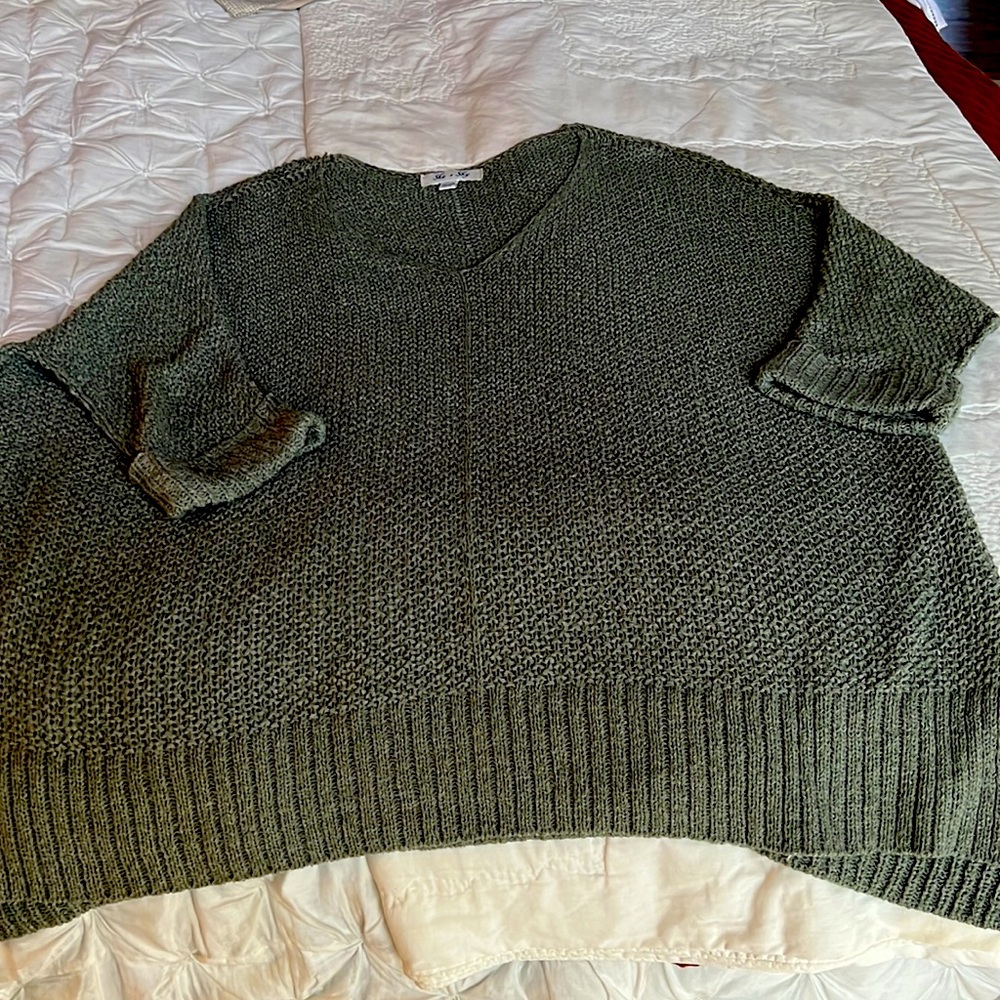 Oversized sweater in a light sage green